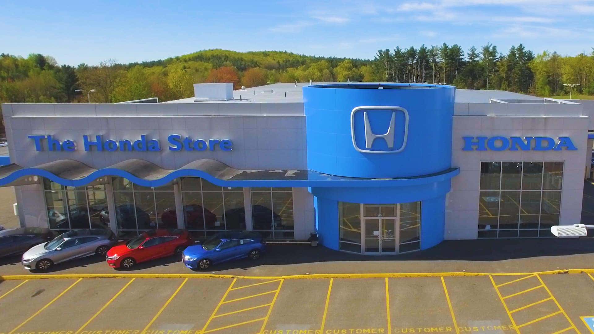 An exterior shot of a Honda dealership