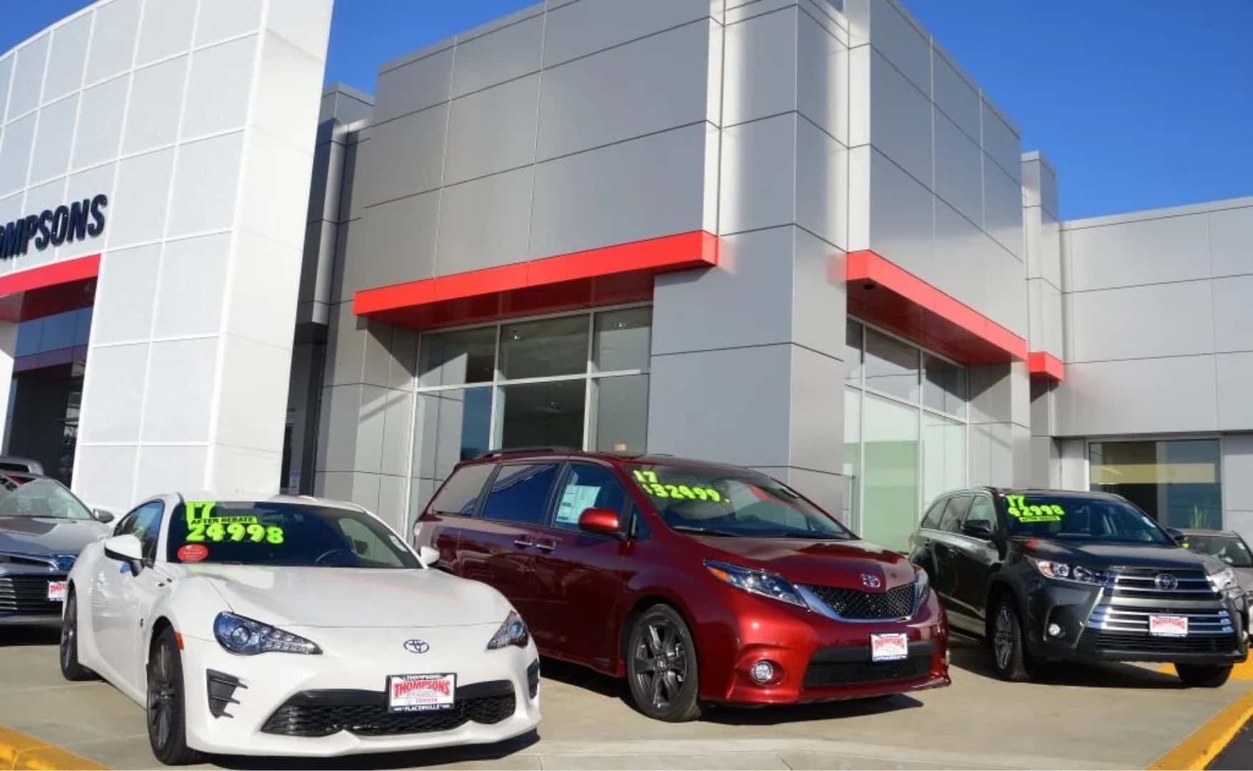 new cars in front of dealership
