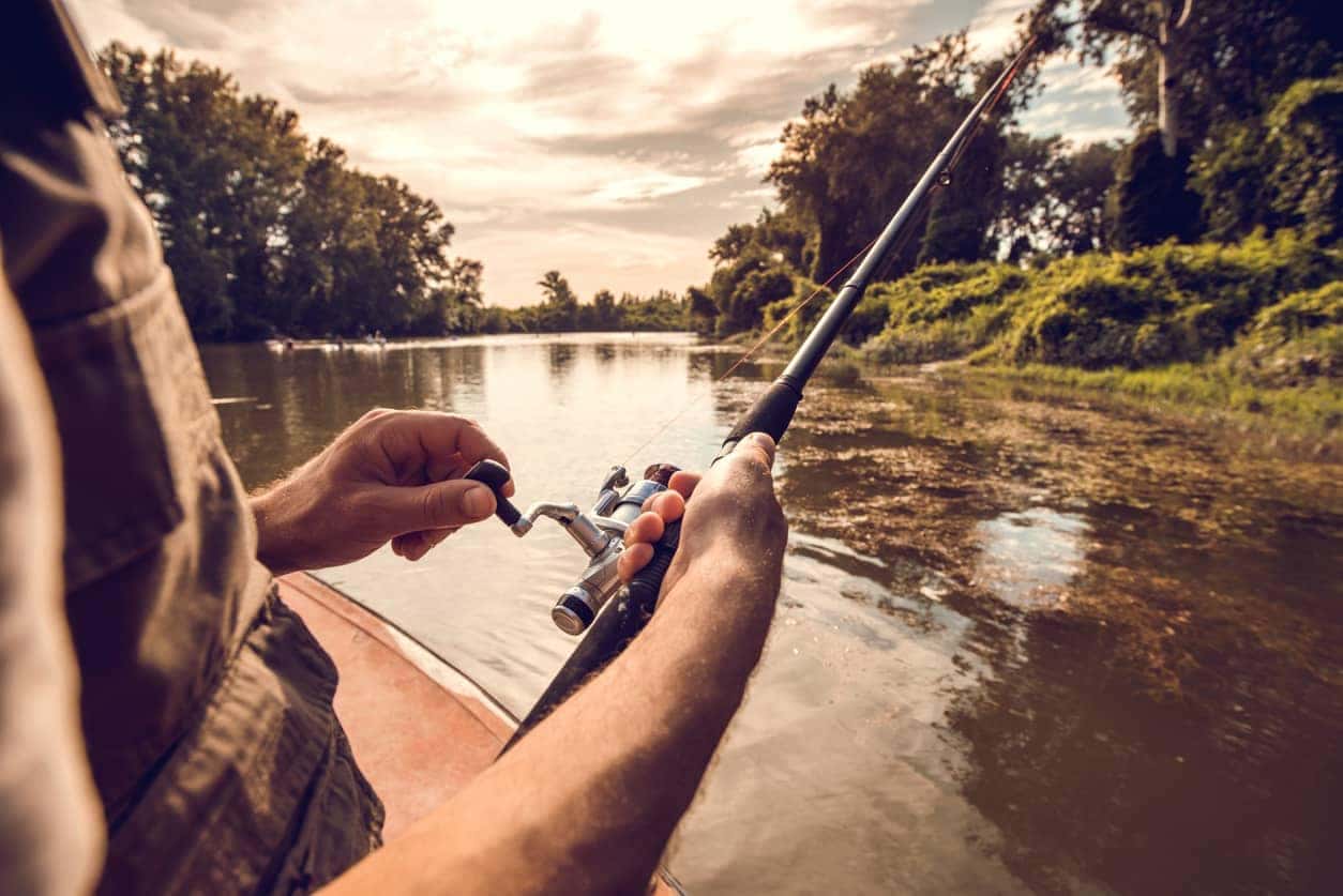 Closeup of someone fishing with a pole