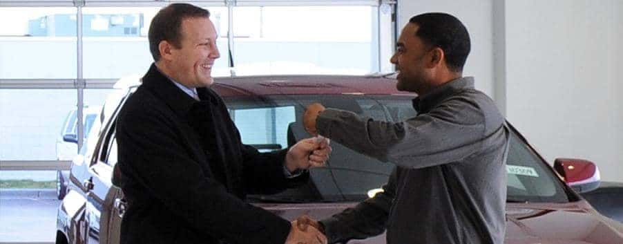 Todd Wenzel salesmen shakes hands with customer