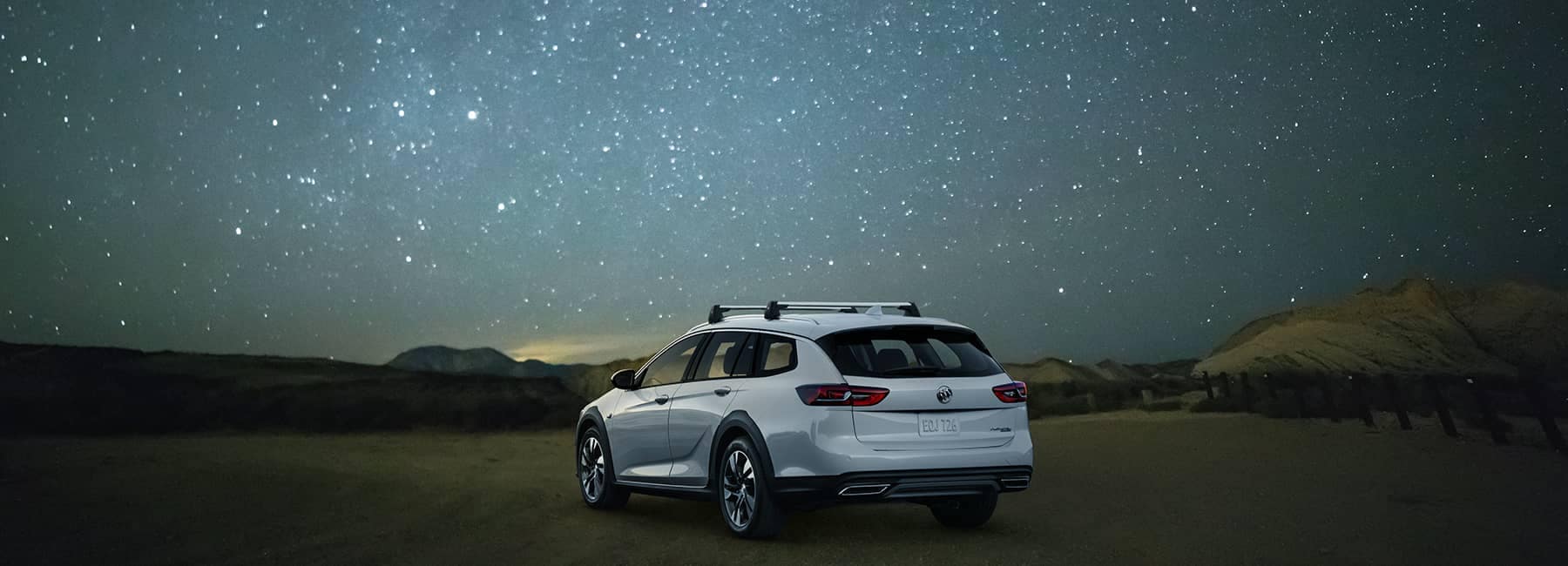 White 2020 Buick Regal TourX under a starry sky