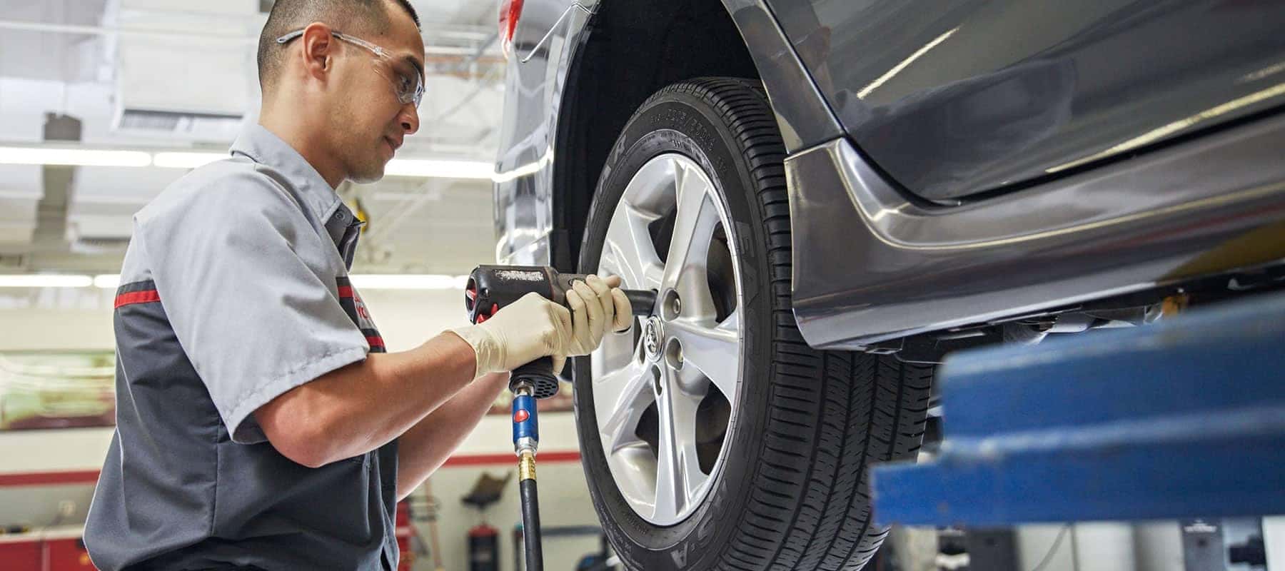 toyota technician installs new tire