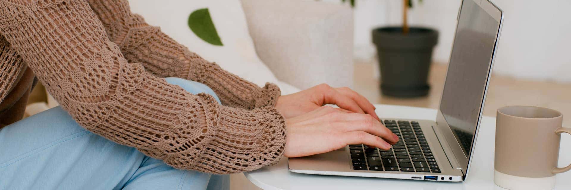Person typing on laptop