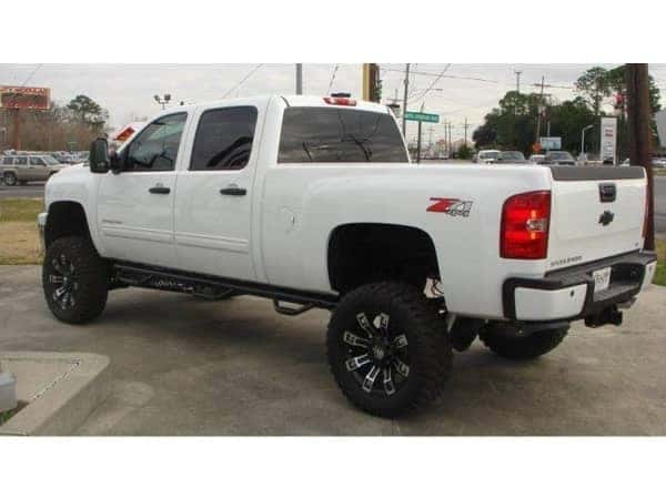 dungeon-garage-slider-13-mobile White lifted Chevy Silverado