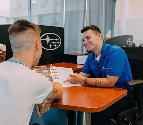 Dealership worker and customer interacting