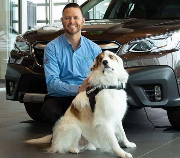 Dealership worker with dog