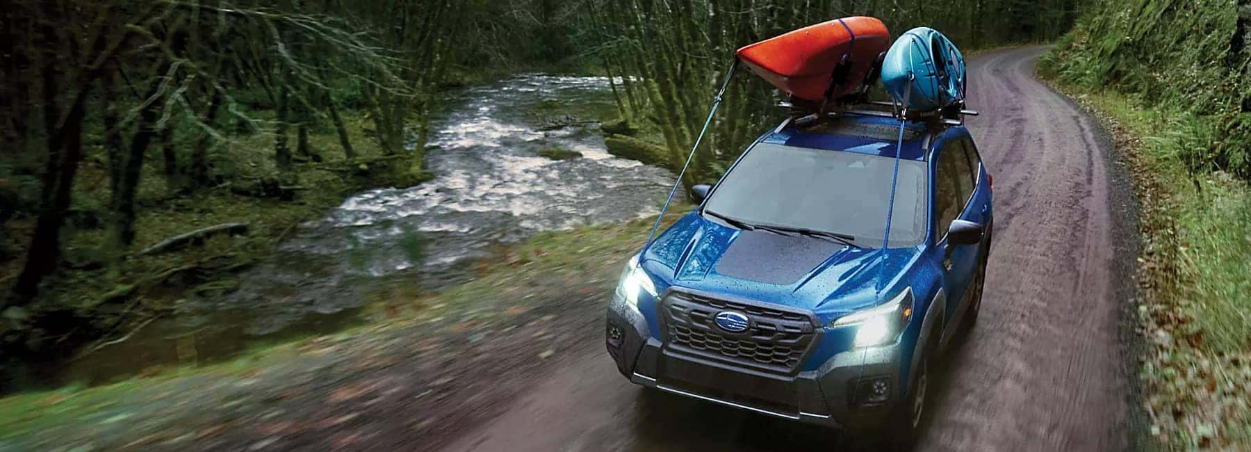 Forester- front view-2 kayaks and creek-navy blue
