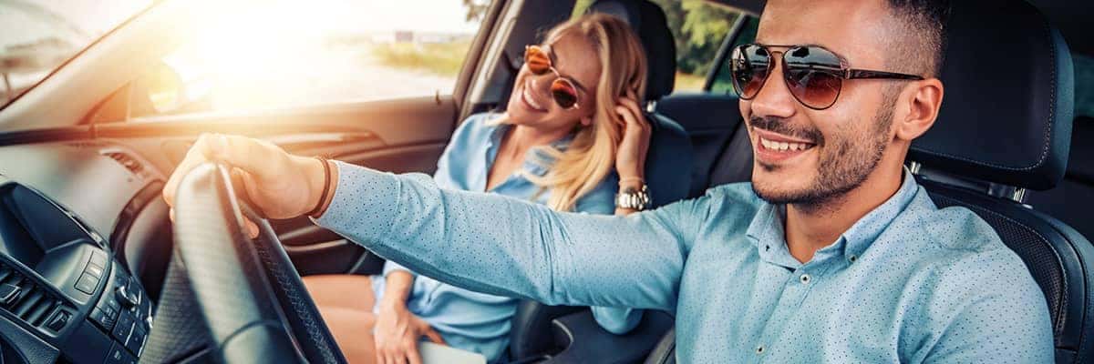 happy couple driving