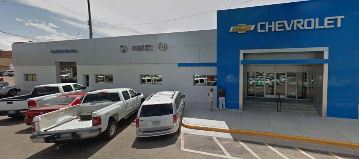 An exterior shot of a Chevrolet dealership at night.