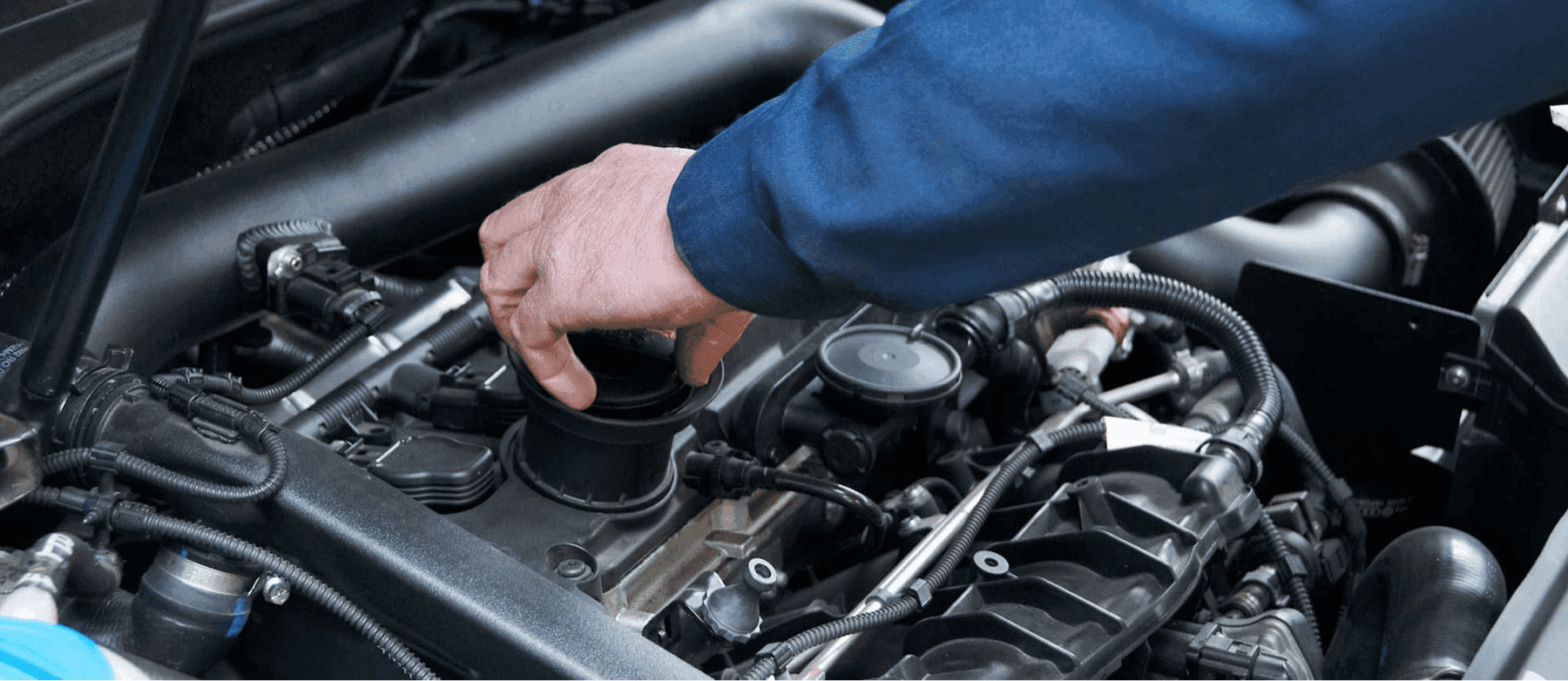 service-technician-checks-engine-cap