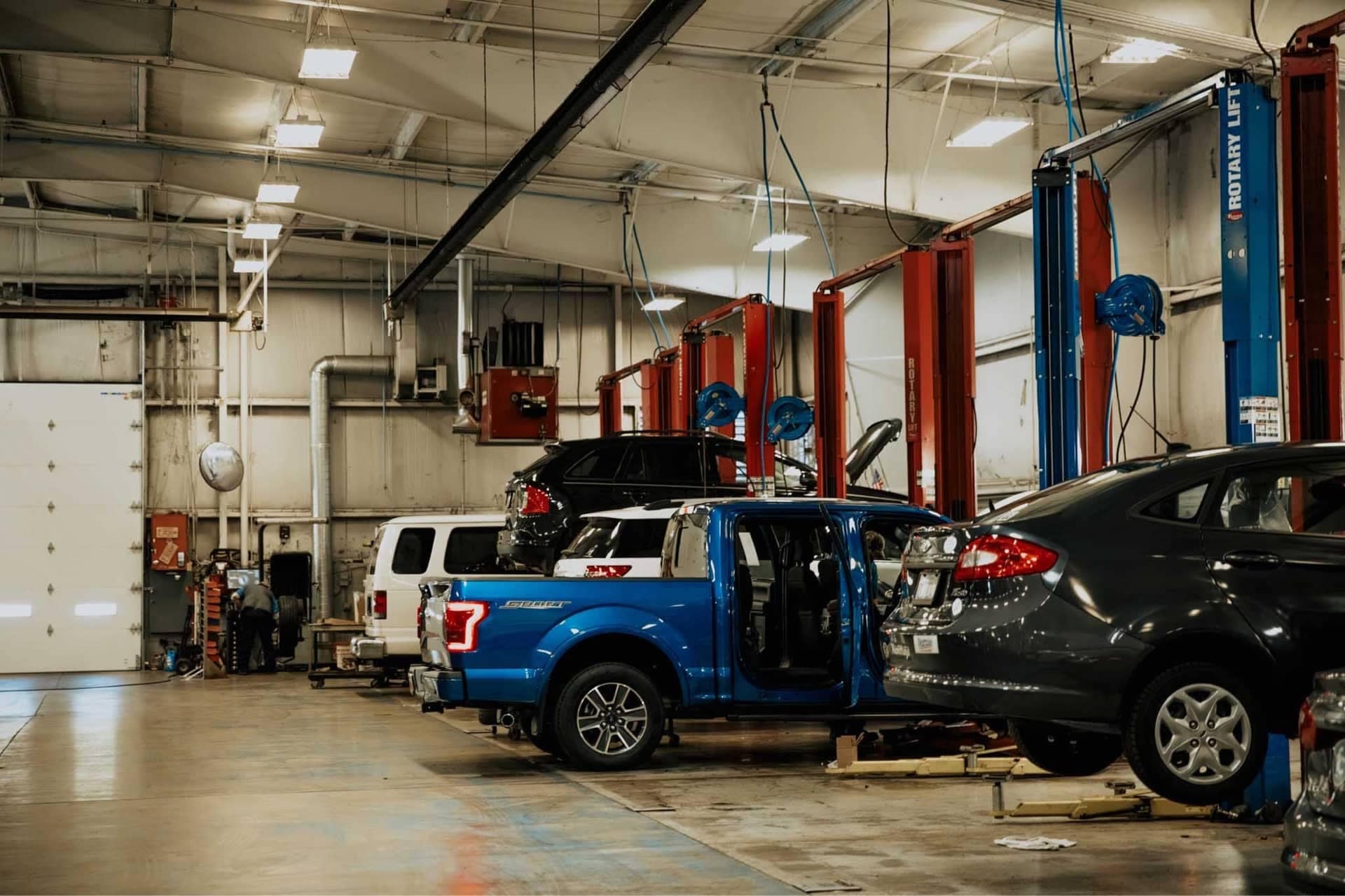 Service garage with vehicles being serviced