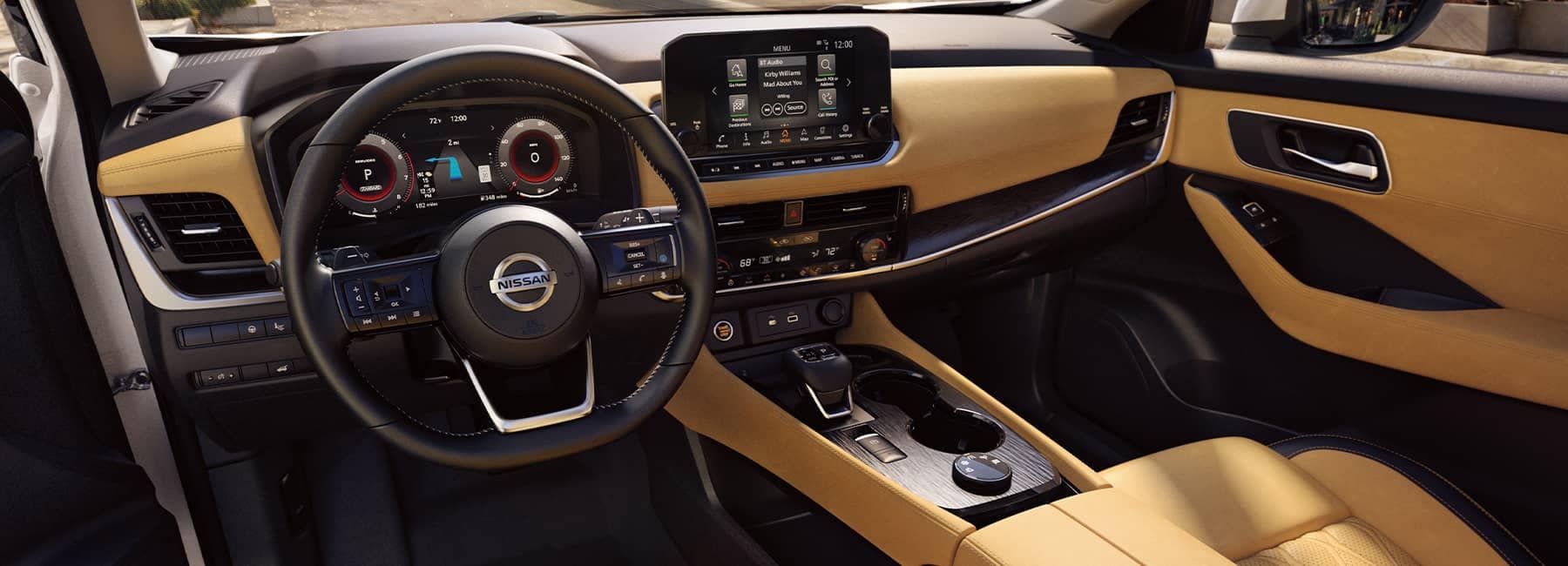 The black and tan leather interior of a 2021 Nissan Rogue