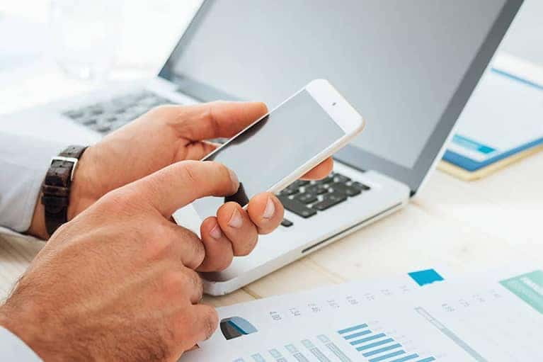 Person typing on smartphone