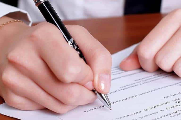 Person writing on paper