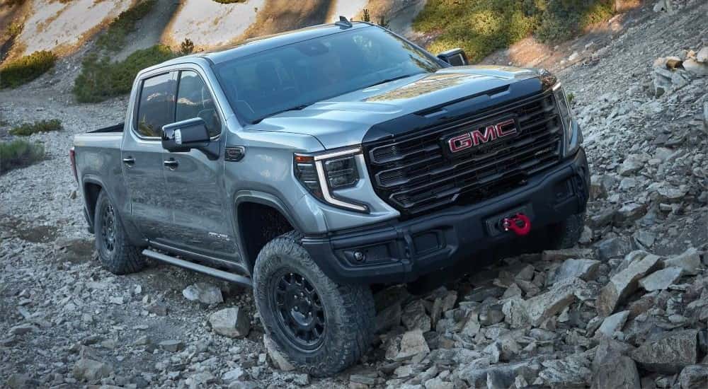 Gray 2024 GMC Sierra 1500 AEV Edition AT4X parked off-road