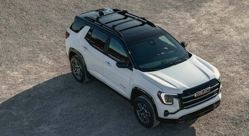 White 2025 GMC Terrain AT4 parked at a GMC dealer near Champaign