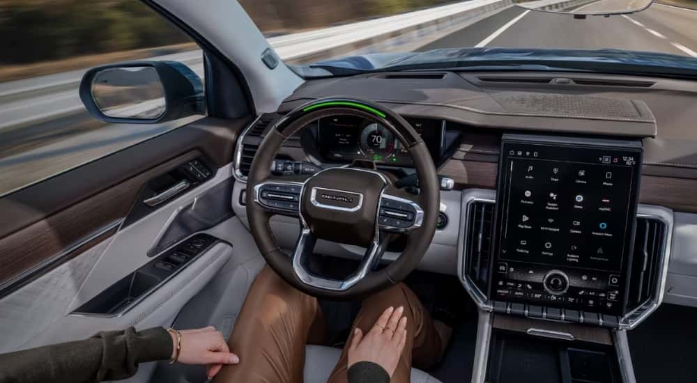 Person using SuperCruise in a 2025 GMC Acadia AT4