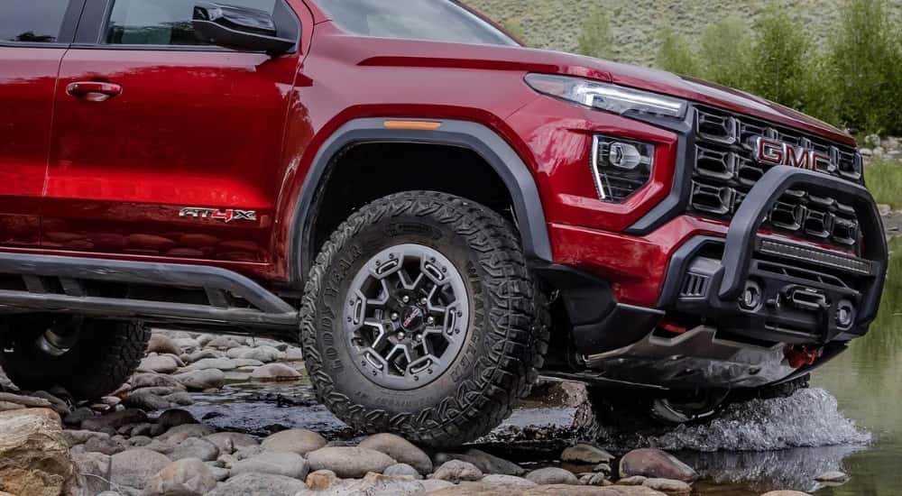 Close-up of the front wheel on a red 2026 GMC Canyon AT4X.