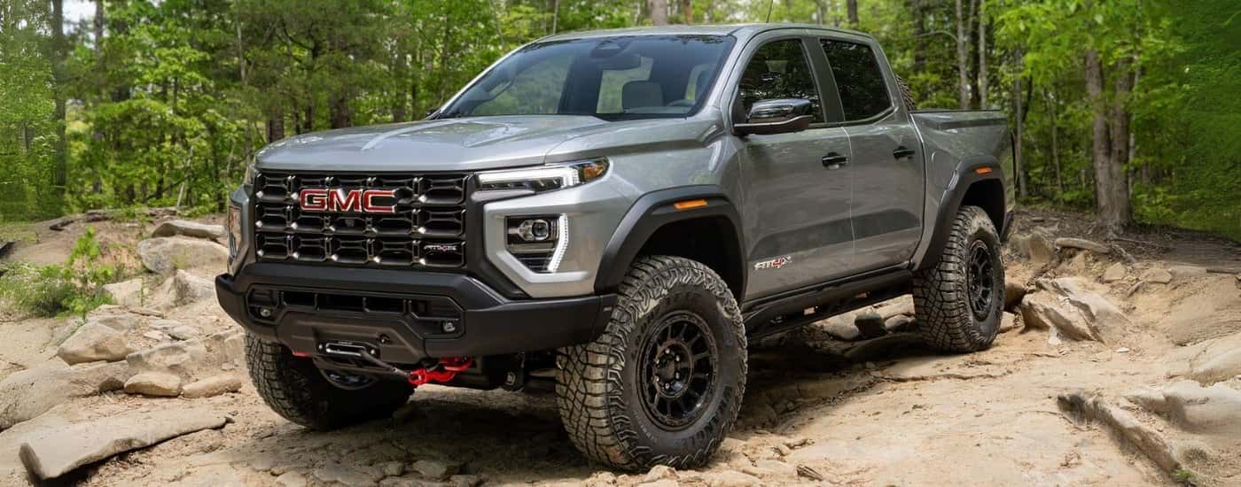 Silver 2026 GMC Canyon parked off-road