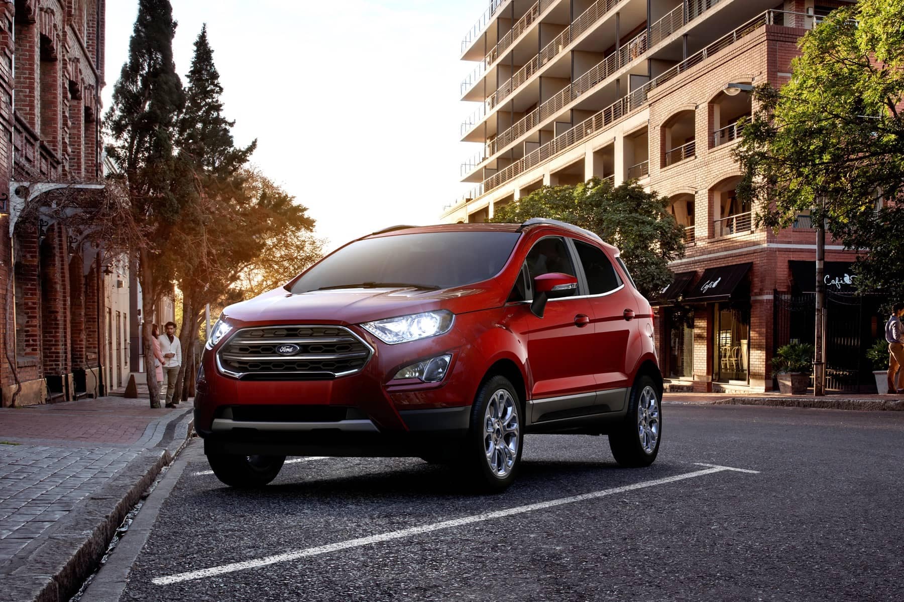 2021 Ford EcoSport in Ruby Red parking at spot near large buildings in city
