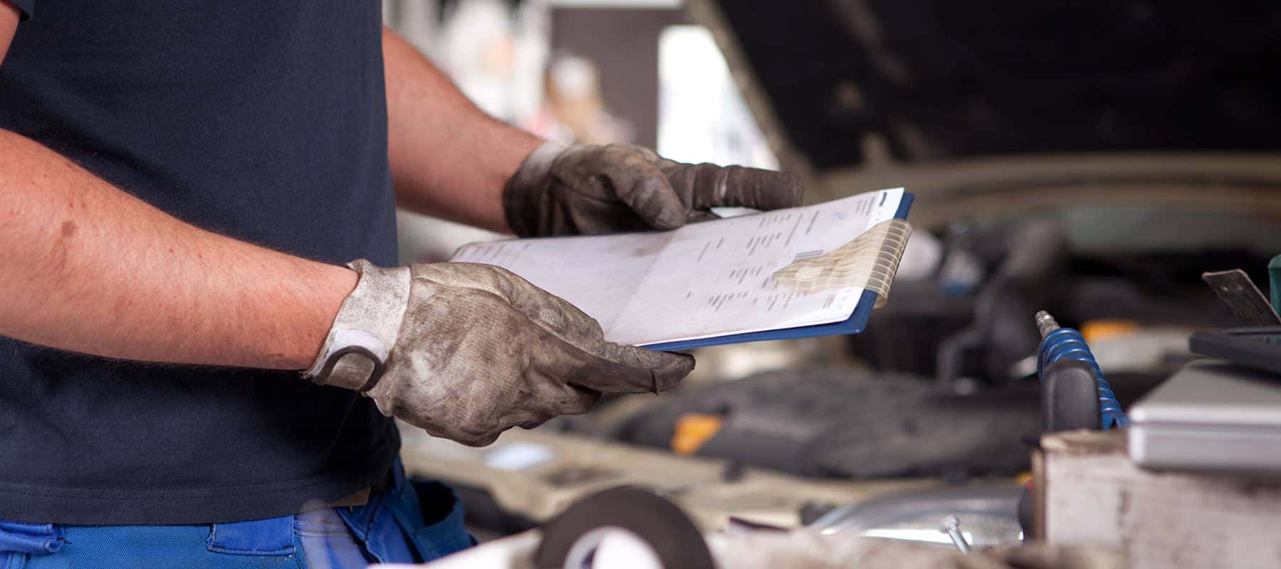 Service picture of technician holding a clipboard