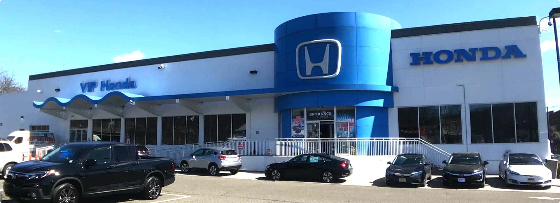 An exterior shot of a Honda dealership.