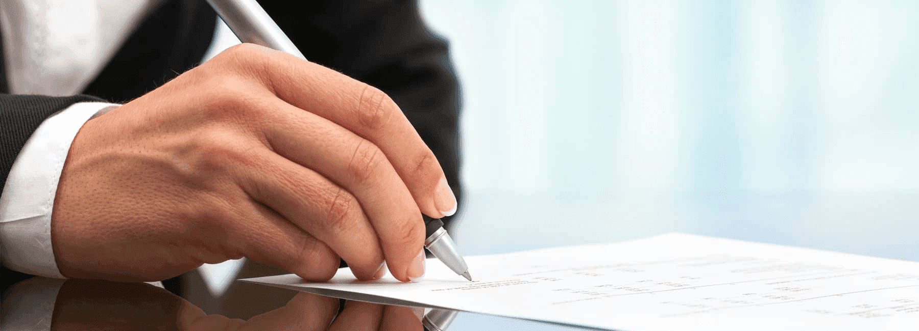 man-signs-finance-docs