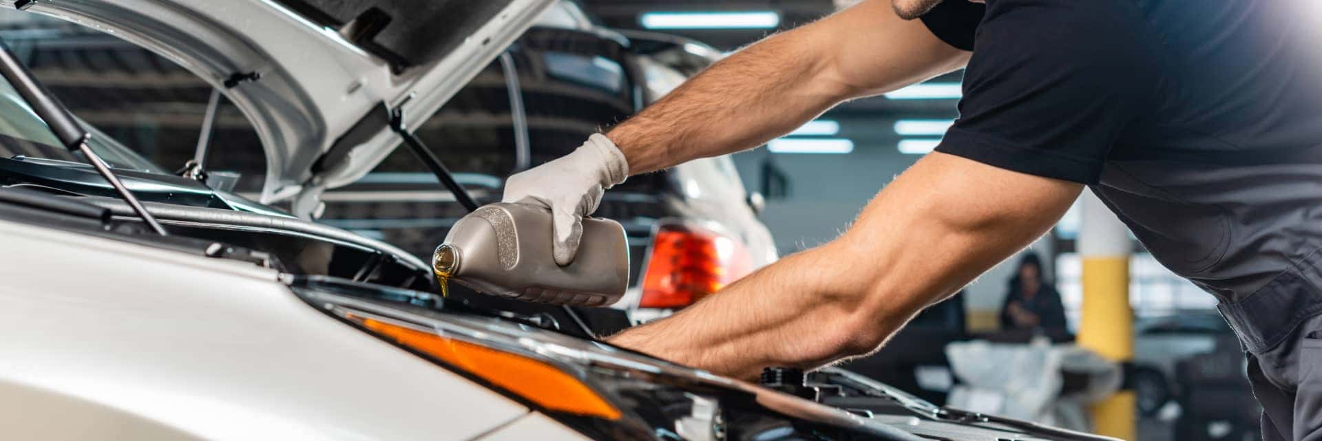 service-specialist-doing-oil-change