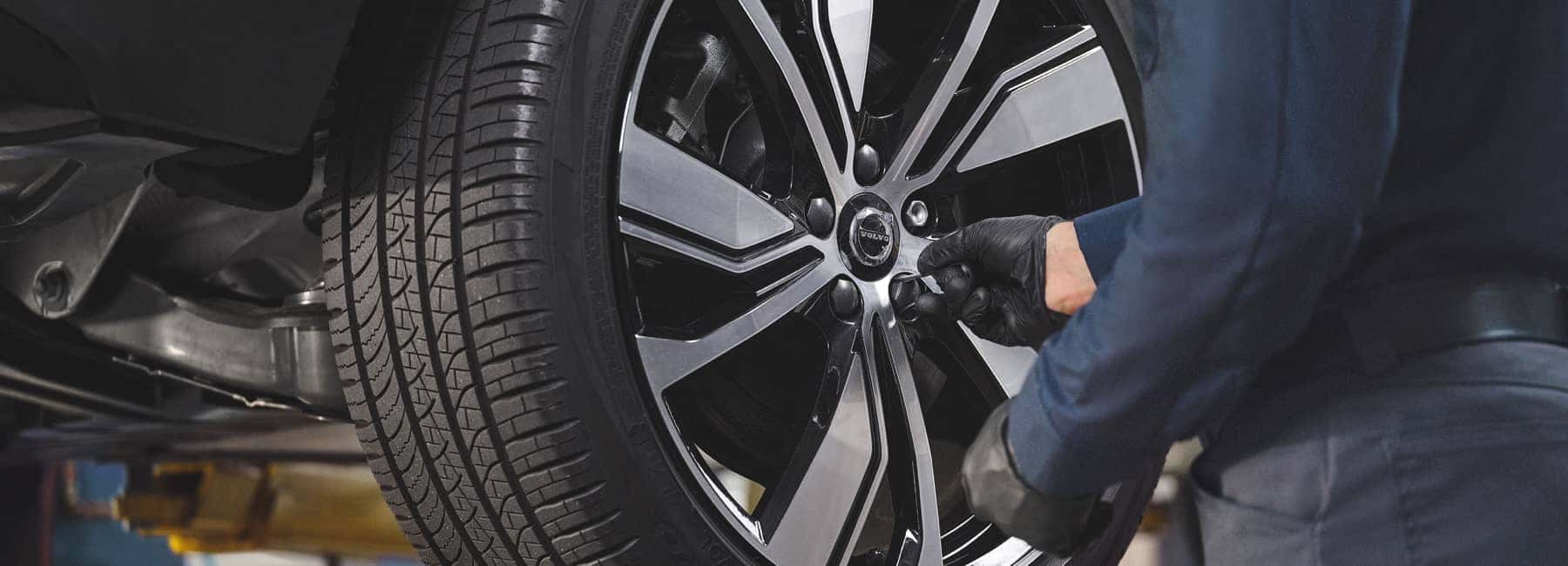Volvo technician working on tires