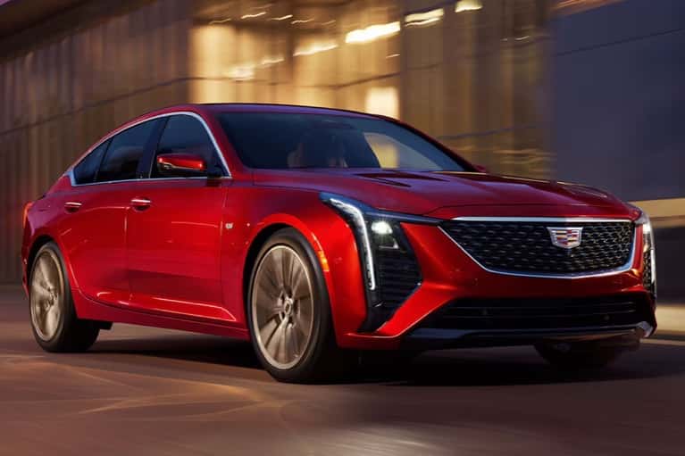 2025-ct5-speeds-along-city-road-at-night-mobile