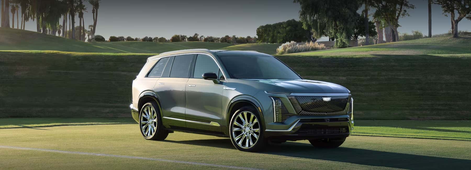 2026-Cadillac-Vistiq-parked-on-grassy-golf-field