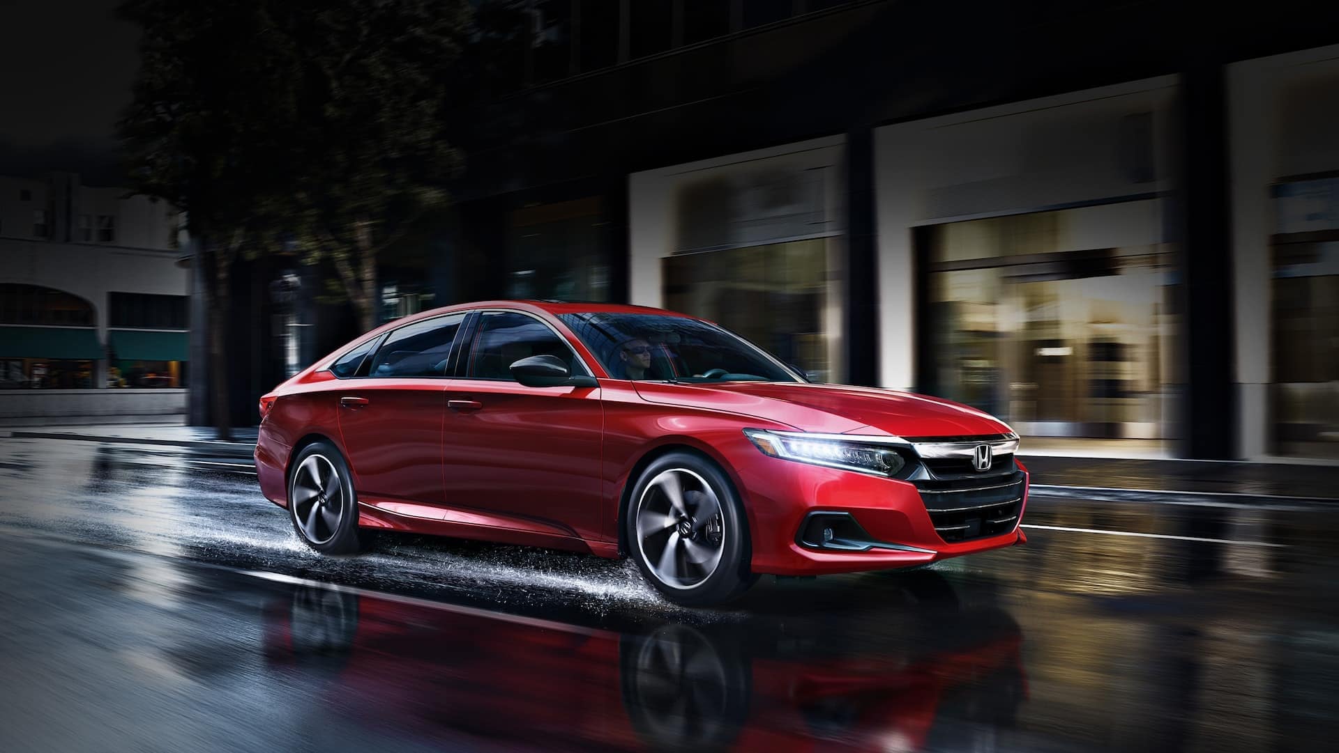 2022-accord-drives-on-wet-city-street