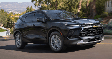 An exterior shot of a black Chevrolet van