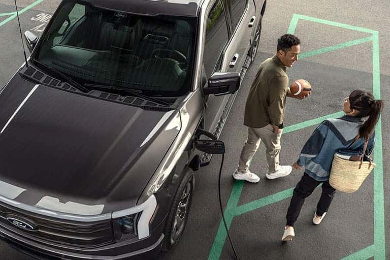 Charging SUV Walking With Football
