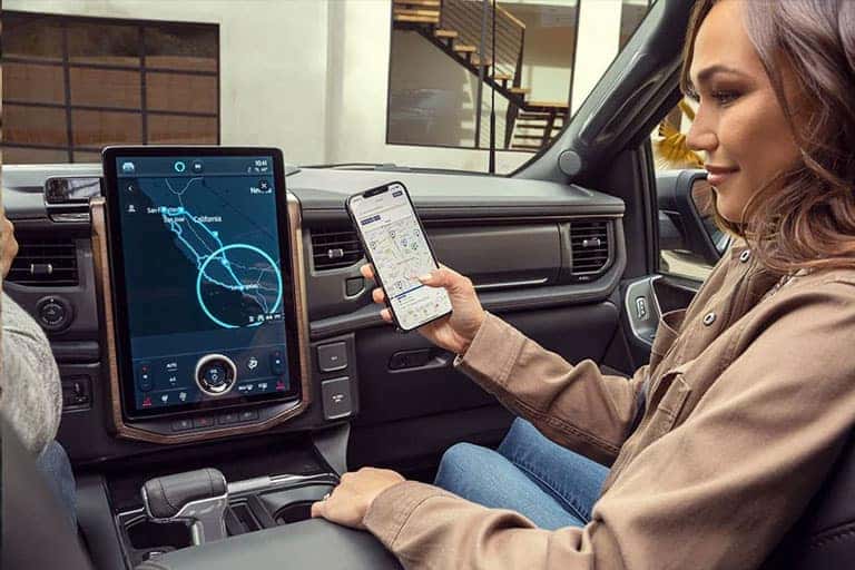 Holding Phone Looking At Map