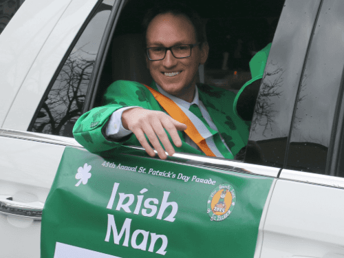 A person in a green and white suit