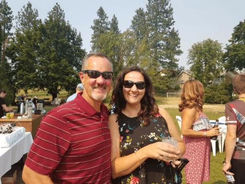Two people standing together outside