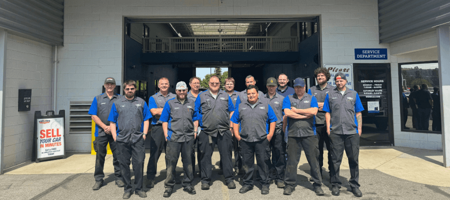 A group of people standing in front of a service center