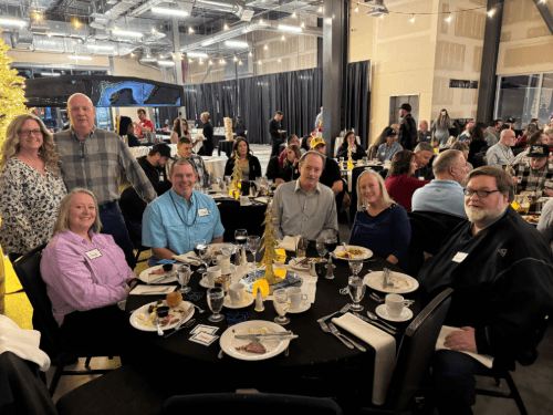 A group of people sitting around a table