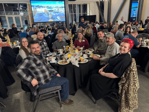 A group of people sitting around a table