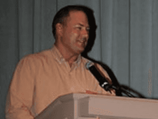 A man standing at a podium