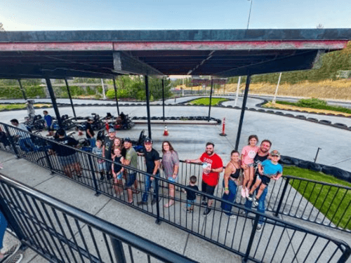 A group of people standing on a walkway