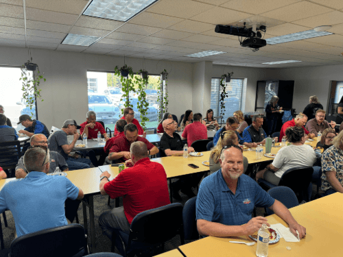 A group of people sitting at tables