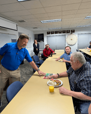 A group of people sitting at a table