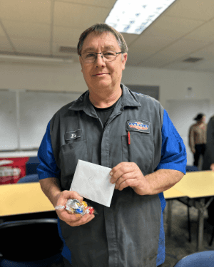 A person holding a bag and an envelope
