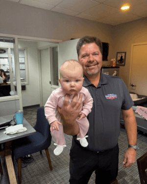 A man holding a baby
