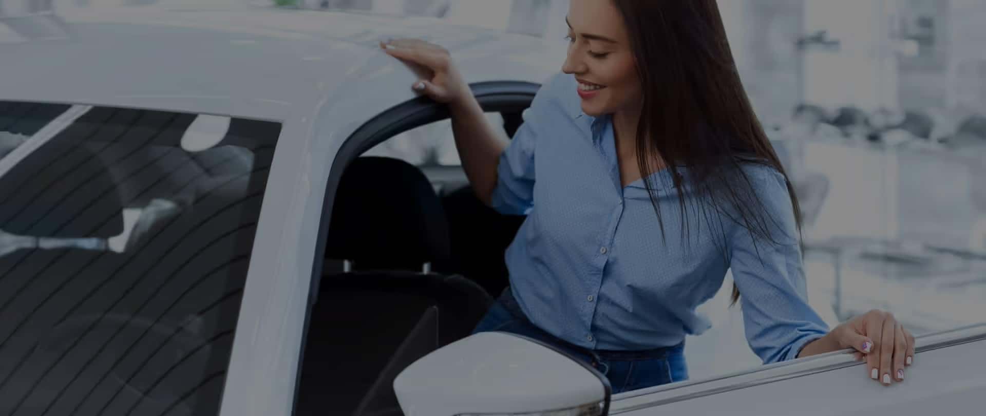 Woman getting into her vehicle