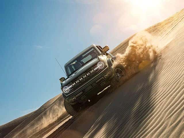 Ford Bronco on desert sand