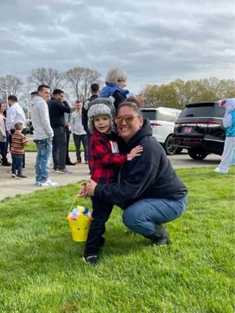 Woman-hugging-child-with-Easter-basket