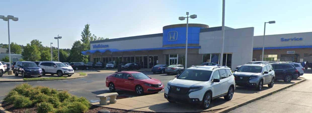 An exterior shot of a Honda dealership during the day.